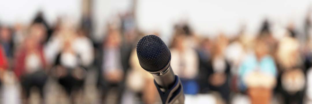 Modern stage microphone against blurred background